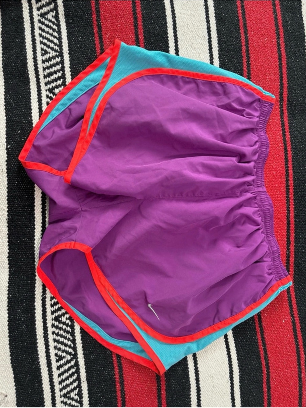 Nike Purple Athletic Shorts with Red Trim and Teal Panels